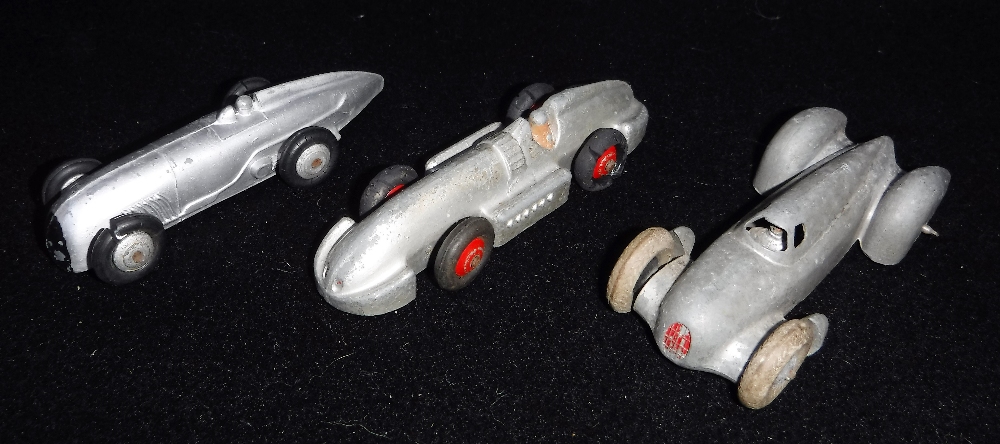 DINKY TOYS; A 1930S 'AUTO UNION' SILVER RACING CAR, A 'Speed of the wind' and another racing car (