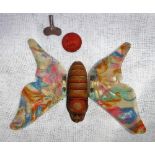 A VINTAGE GERMAN TIN PLATE CLOCKWORK BUTTERFLY with multi-coloured celluloid wings (with key) 4"