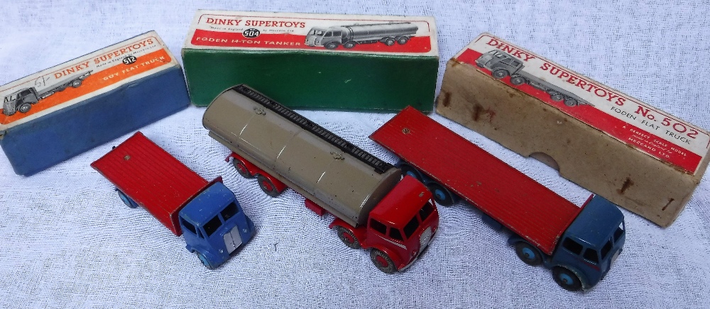 DINKY SUPERTOYS; A FODEN FLAT TRUCK (No 502), A Foden 14-ton Tanker (No 504) and a Guy Flat Truck (