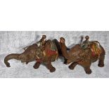 A VINTAGE PAINTED WHITE METAL INDIAN ELEPHANT with rider and seat, trunk up 4" high and another