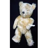 A VINTAGE PLUSH TEDDY BEAR in need of love