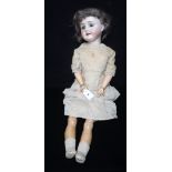 AN EARLY 20TH CENTURY PORCELAIN HEADED DOLL, marked 'Special 65' with composite body and limbs,