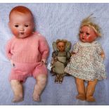 AN EARLY 20TH CENTURY WAX 'CHRISTMAS TREE DOLL' and two similar vintage dolls (note all have some