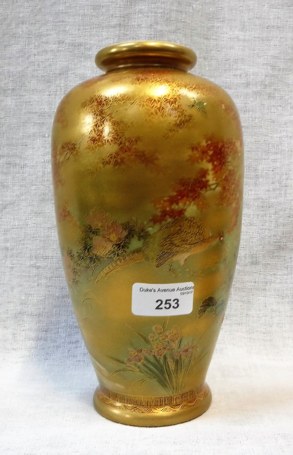 A JAPANESE SATSUMA VASE decorated with birds amongst a decorated landscape