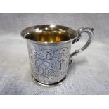 A VICTORIAN SILVER CHRISTENING MUG with scrolling handle