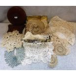 A QUANTITY OF LACE, LINEN AND A LEATHER COVERED TAPE MEASURE