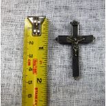 A WHITE METAL HOLLOW CRUCIFIX