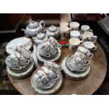 A LARGE JAPANESE EGGSHELL TEASET, for 12, and a collection of Royal commemorative mugs