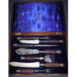 A CASED SET OF MAPPIN & WEBB CARVING CUTLERY with silver mounts and collars, with horn handles