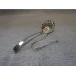 A SILVER LADLE with shell-shaped bowl and a similar pair of tongs