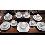 A COLLECTION OF 1920S SHELLEY TEAWARE, in white with blue banding