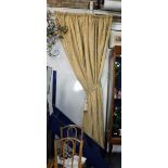 AN EXTENSIVE SUITE OF GOLD VELVET DAMASK CURTAINS, each lined and interlined, with tie backs,