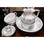 A VICTORIAN SPODE JUG AND BOWL SET with gilt decoration and similar chamber pots