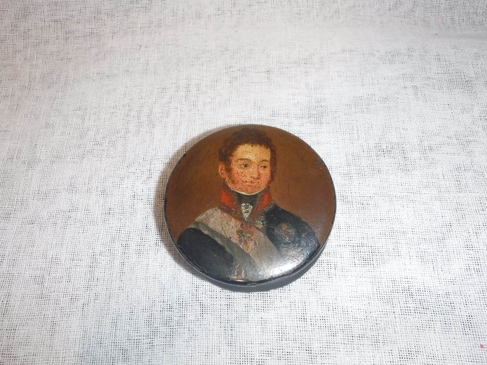 AN EARLY 19TH CENTURY CIRCULAR PAPIER MACHE BOX, with a painted portrait of a member of Royalty,