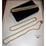 A CULTURED PEARL NECKLACE, the clasp set with three pearls and four small diamonds and another pearl