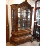 A REPRODUCTION DUTCH WALNUT CABINET of bombé form, 51" wide