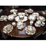 A ROYAL ALBERT 'OLD COUNTRY ROSES' DINNER SERVICE and a Royal Stafford bone china teaset
