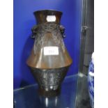 A CHINESE PATINATED BRONZE VASE with nine character mark to the base, 10" high