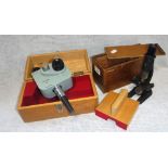 A VINTAGE SCHOOL MICROSCOPE in a pine box and a 'Watson' viewing instrument in a fitted box (2)