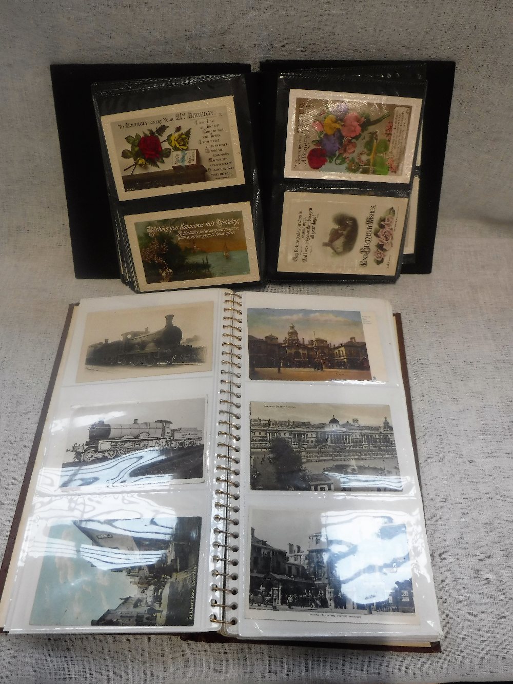 TWO ALBUMS OF POSTCARDS, including topographical views, World War II aircraft and other subjects (