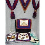 A BLACK SUITCASE containing four ceremonial Masonic aprons and other Masonic items, a Masonic