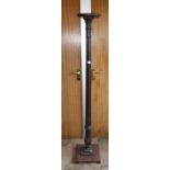 A CARVED MAHOGANY TORCHERE, 62.5" high