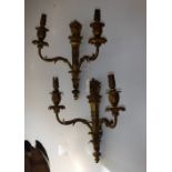 A SET OF THREE BRASS ELECTRIC WALL LIGHTS with swag decoration
