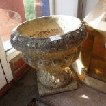 A RECONSTITUTED STONE GARDEN URN 15" high