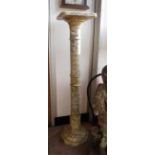 A TURNED MARBLE TORCHERE on an octagonal plinth 37" high