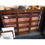 AN EDWARDIAN MAHOGANY THREE DOOR DISPLAY CABINET, 65" wide