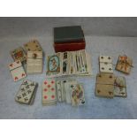 A COLLECTION OF 19TH CENTURY PLAYING CARDS including square cornered examples and Tarot cards