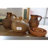 VERWOOD POTTERY: A Costrel or 'owl', 7" dia, a flower ring, a jug and a flagon (damaged)