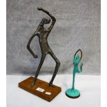 AN ALUMINIUM STYLISED STUDY OF A MAN, the wooden base with label 'Manuscript Fine Quality Art