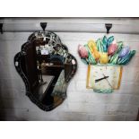 A VENETIAN STYLE WALL MIRROR of shield form and a brightly decorated ceramic kitchen clock (2)