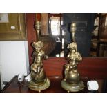 A PAIR OF BRASS AND ONYX TABLE LIGHTS decorated with figures