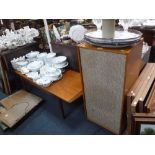 A VINTAGE TEAK COFFEE TABLE and a large speaker