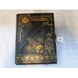 A VICTORIAN TOOLED LEATHER BOUND MUSICAL PHOTOGRAPH ALBUM, playing two airs, including 'Are We to