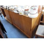 A PAIR OF 1960S TEAK SIDE CABINETS with sliding doors (possibly G Plan)