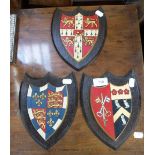 THREE EARLY 20TH CENTURY HAND PAINTED WOODEN PLAQUES by A.W. Crisp & Co, Cambridge