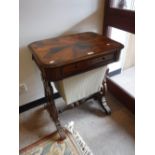 A VICTORIAN WORK TABLE, the parquetry top inset with differing veneers, with fretwork sides and