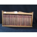 COLLINS' ILLUSTRATED DICKENS, twenty gilt leather bound vols in an oak display shelf