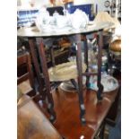 A FOLDING BRASS TRAY TOP TABLE and an Oriental teaset