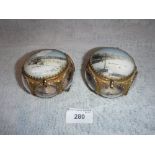 A PAIR OF PALAIS ROYALE STYLE TRINKET BOXES with gilt metal frames and panels of glass, each