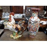 A LARGE GLAZED AND BRIGHTLY DECORATED CERAMIC COCKEREL, 21" high and an Oriental Vase, 23.5" high (