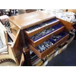 A VICTORIAN OAK CANTEEN containing a quantity of silver plated cutlery