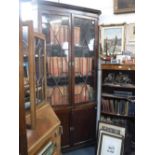 A GEORGE III STYLE MAHOGANY CORNER CABINET, with astragal glazed upper section, 94" high x 43" wide