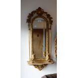 A PAIR OF 19TH CENTURY GILT PLASTER FRAMED GIRANDOLE, each fitted a shelf, 33" high x 14" wide