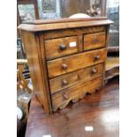 A VICTORIAN MINIATURE CHEST OF DRAWERS, 12.5" high x 13" wide
