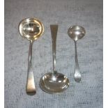 A PAIR OF GEORGE III SILVER SAUCE LADLES and one other smaller ladle (3)