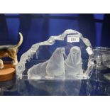 `A CAST GLASS ORNAMENT OF TWO WALRUS signed 'Yonesson'